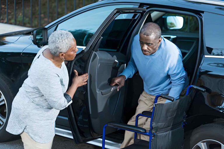 senior-transportation-indiana-caregiver-helping-elderly-man-into-car